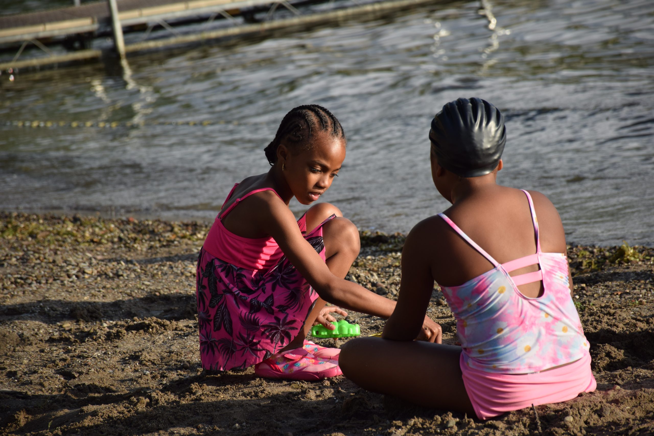 two girls playing in the sand