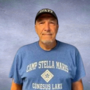 Mondo picture of a man with a baseball cap and blue shirt