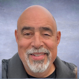John picture of a man bald, gray goatee